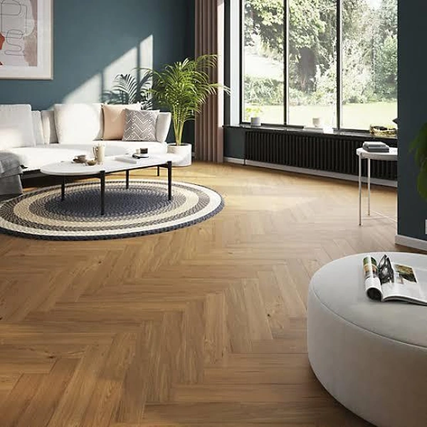 Classic honey oak wood herringbone flooring in a lounge