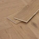 Herringbone wood floor planks showing tongue and groove detail