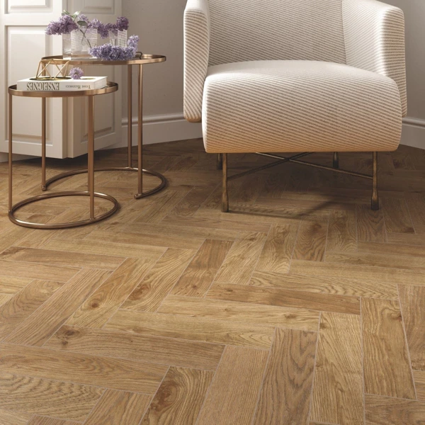 Light wood herringbone pattern flooring.