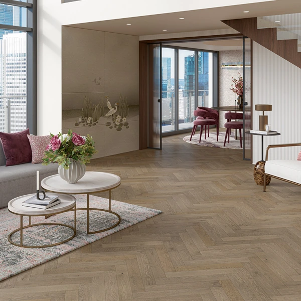 Modern hotel living room with herringbone wood flooring.