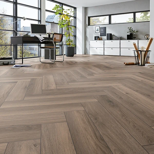 Textured brown laminate wood herringbone flooring